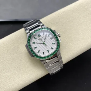 AAAAA Replica Patek Philippe Nautilus 5711 White Dial Green Gemstone Bezel 40mm Automatic Stainless Steel Luxury Watch Side Profile Of The Dial 1
