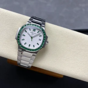 AAAAA Replica Patek Philippe Nautilus 5711 White Dial Green Gemstone Bezel 40mm Automatic Stainless Steel Luxury Watch Side Profile Of The Dial 2