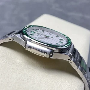 AAAAA Replica Patek Philippe Nautilus 5711 White Dial Green Gemstone Bezel 40mm Automatic Stainless Steel Luxury Watch Side View 1