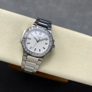 Super Clone Patek Philippe Nautilus 5711/110P-010 Replica 40mm White Embossed Dial Baguette Diamond Markers Diamond Bezel Watch Side Profile Of The Dial 2