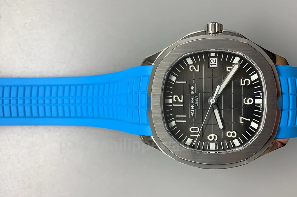 Patek Philippe Aquanaut 5167A-001 Replica 40.8mm men's luxury sport watch with black-gray embossed dial and sky blue rubber strap.