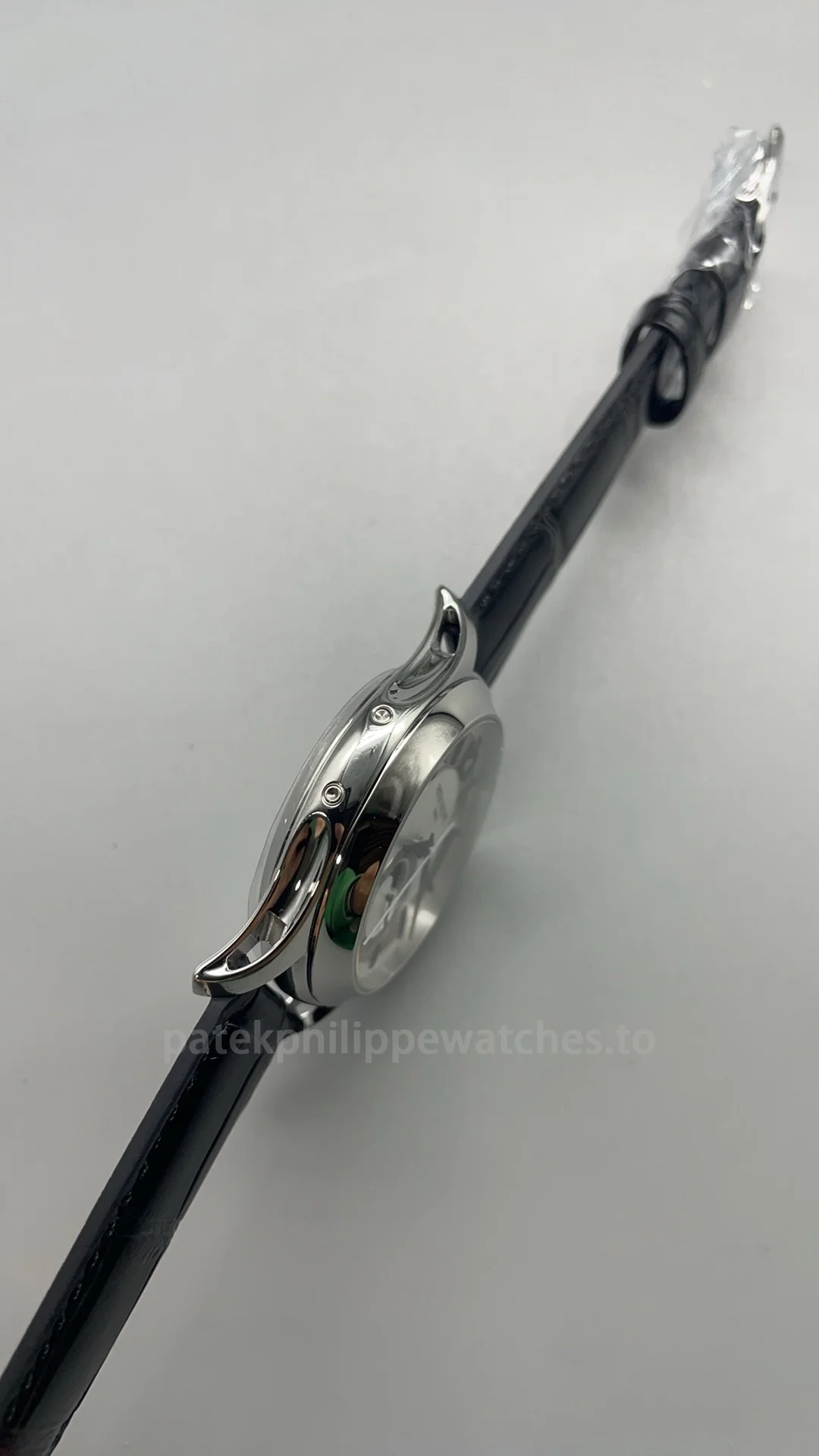 Patek Philippe Complications 5205G-001 Replica 40mm Automatic Men's Annual Calendar Dress Watch with Silver & Rhodium Dial-Left Side Patek-Philippe-Complications-5205G-001-Replica-40mm-Automatic-Mens-Annual-Calendar-Dress-Watch-with-Silver-Rhodium-Dial-Left-Side
