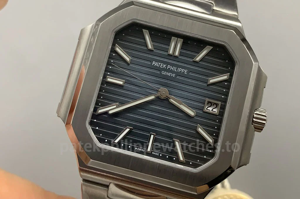Patek Philippe Cubitus 7128/1G-001 Replica 40mm with blue-grey sunburst dial, horizontal embossed texture, stainless steel case and integrated bracelet