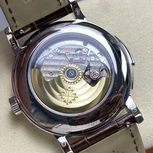 Specification Table Specification Details Model 5178G-001 Movement Clone Caliber R 27 PS Functions Hours, Minutes, Small Seconds, Minute Repeater Case Diameter 35.6mm Case Material 904L Stainless Steel, White-Gold-Tone Finish Dial Ivory Grand Feu-Style Enamel Dial with “EMAIL” Marking Hour Markers Applied 18K Gold Breguet-Style Arabic Numerals Bezel 904L Stainless Steel, Fixed Circular Polished Bezel Crystal Sapphire Crystal with Colorless Anti-Reflective Coating Strap Chocolate-Brown Alligator Leather Water Resistance 30m