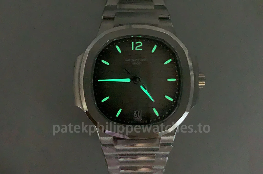 Super Clone Patek Philippe Nautilus 7118/1A-011 35.2mm women's watch with gray wave dial, luminous markers, date display, and stainless steel bracelet.